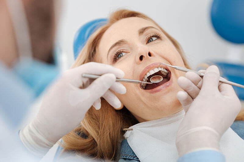 Woman getting a dental checkup at the dentist